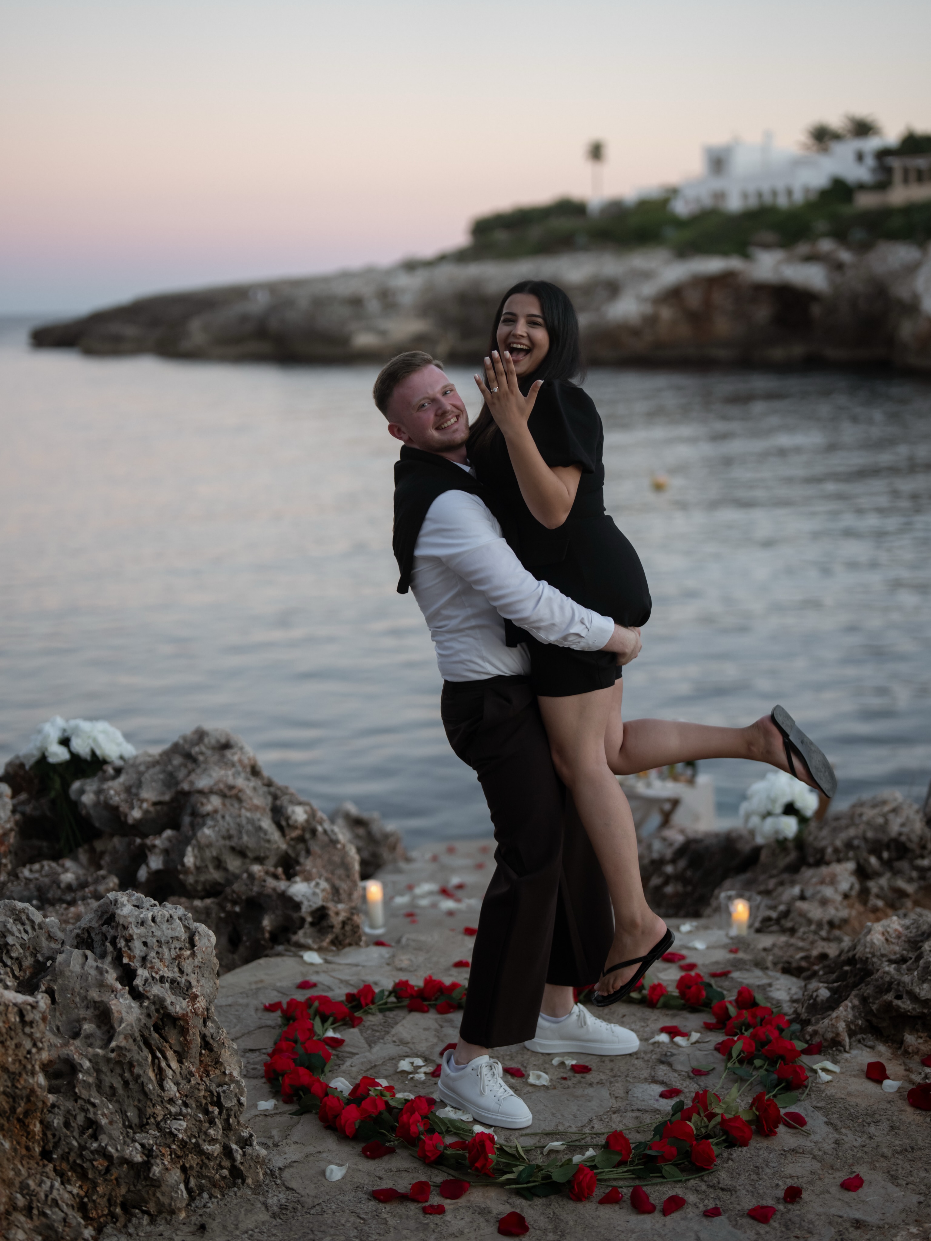 Christian lifting Rika as she shows the ring