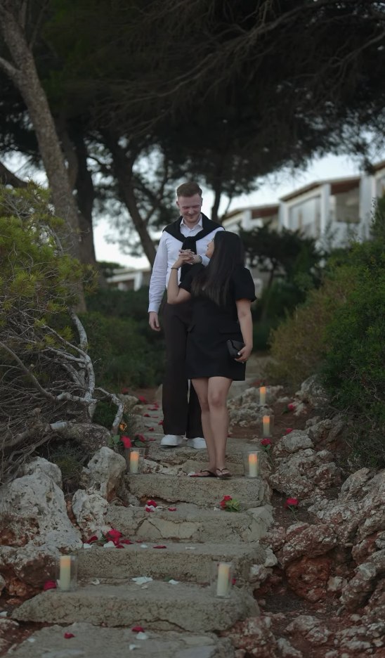 Walking down the candlelit steps, smiling
